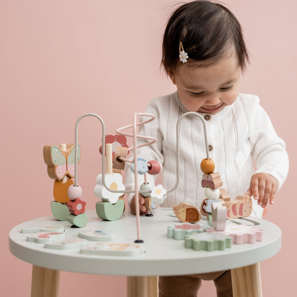 Girl playing with Little Dutch products