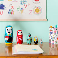 Petit Monkey nesting dolls in the woods