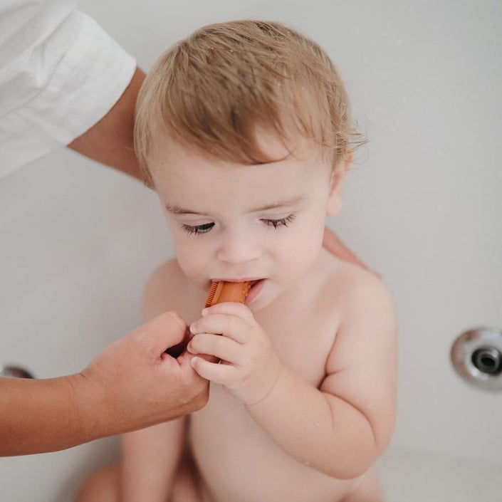 Mushie baby toothbrush sand clay