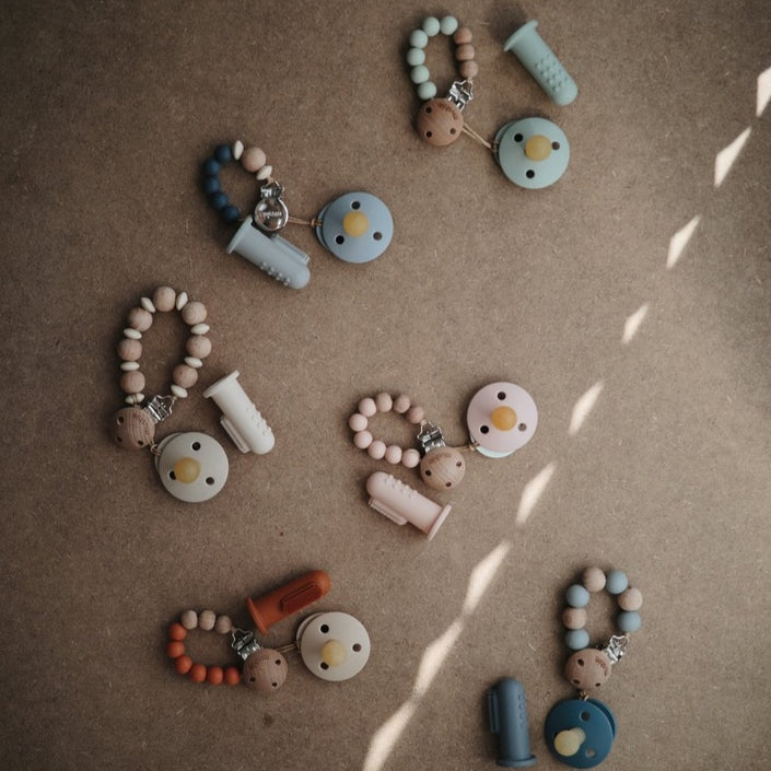 Mushie baby toothbrush sand clay