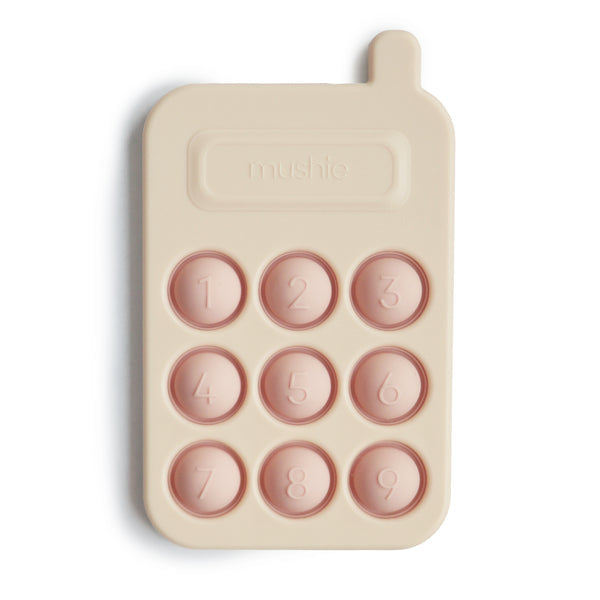 Mushie pop it phone blush 10 months +