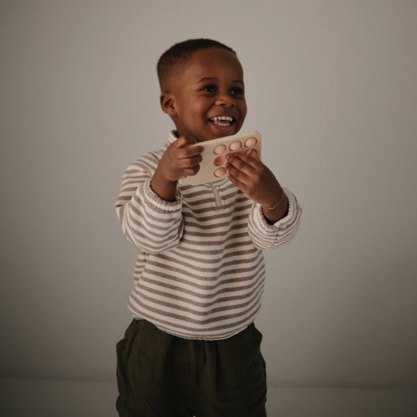 Mushie pop it phone blush 10 months +