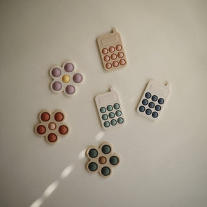 Mushie pop it phone cambridge blue 10 months +