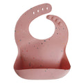 Mushie silicone bib Pink Confetti