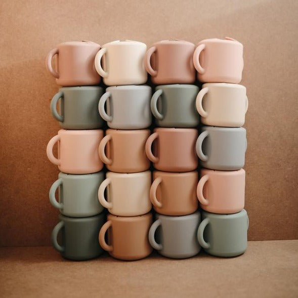 Mushie snack cup shifting sand