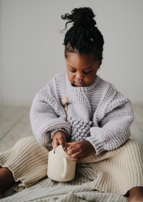 Mushie snack cup shifting sand